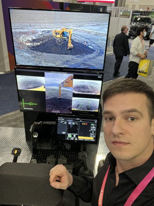 Bart Andrzejewski at CES 2023, remotely controlling an excavator