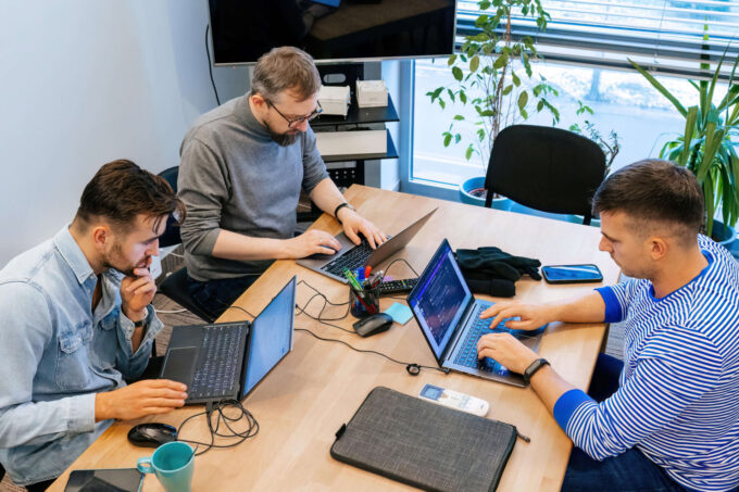 Group of Kotlin backend development team working in an office