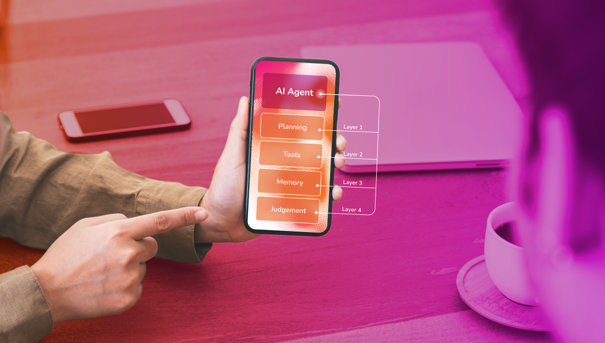 Person holding a smartphone displaying an AI agent layer diagram with Planning, Tools, Memory, and Judgement, against an orange-to-magenta gradient background with a laptop and coffee cup on the desk